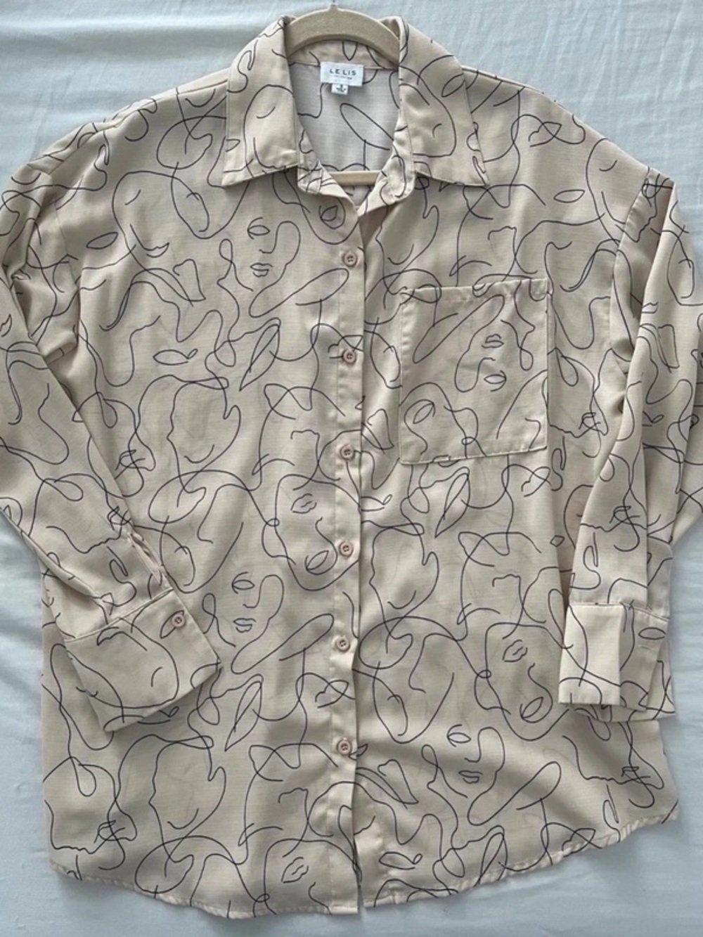Le Lis Beige Button-Front Blouse with Black Abstract Face Lines